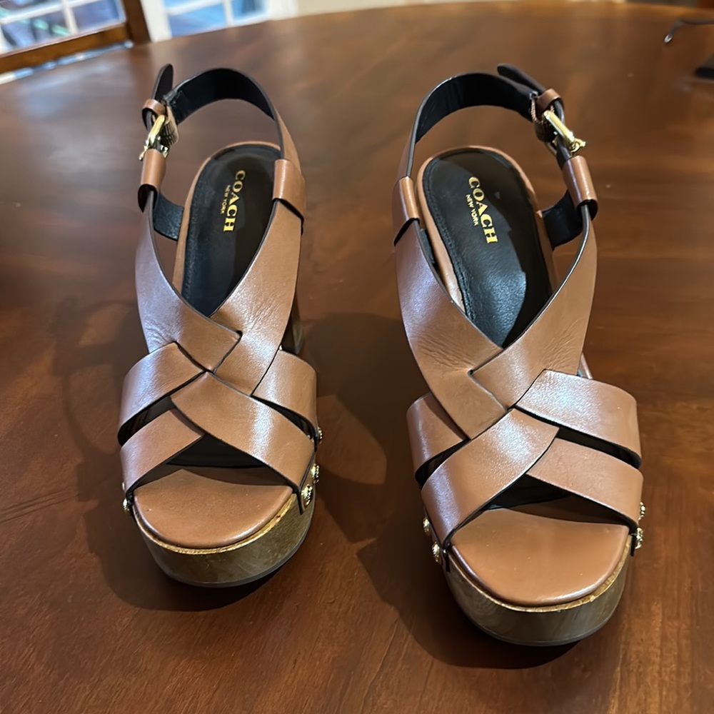 Coach, women’s heels, size 7B. Worn only once because they are too tall for me